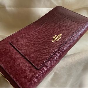 Coach zip around wallet in burgundy